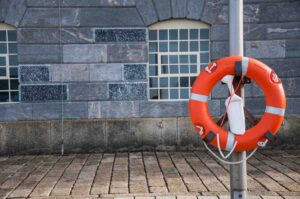 White Buoy with an Orange Square and Black Lettering